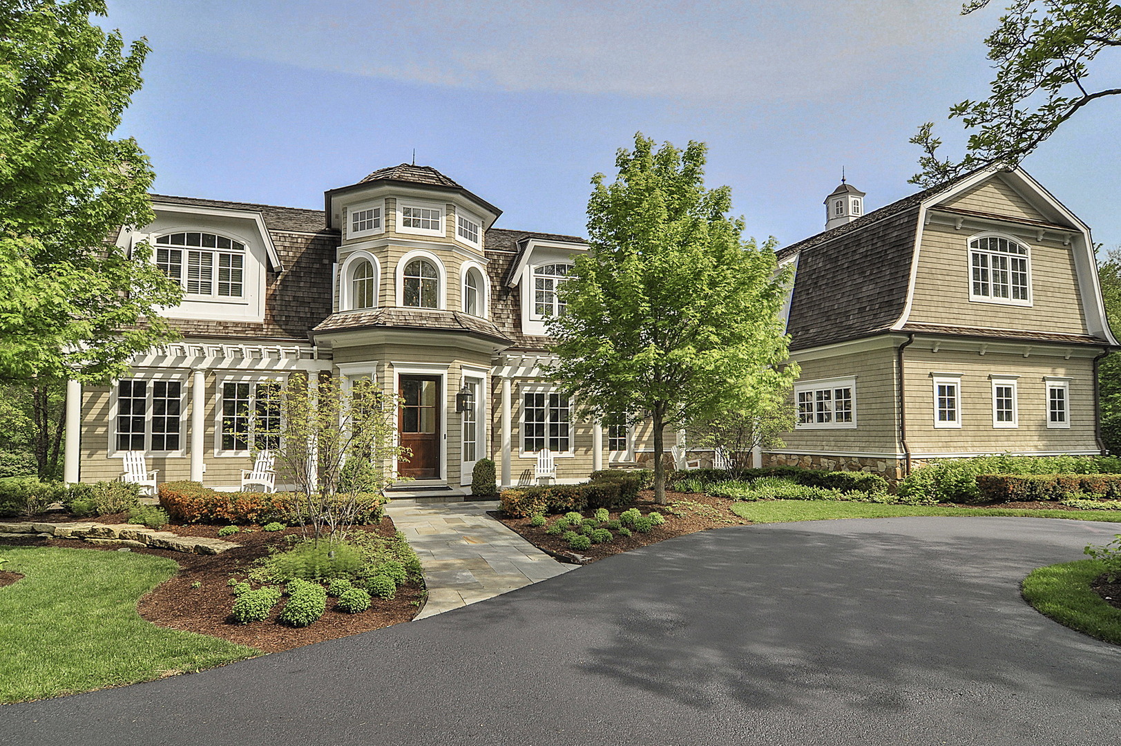 701 Plamondon Road Wheaton, IL 60189 - Photo 4 of 79 a front view of a house with a garden