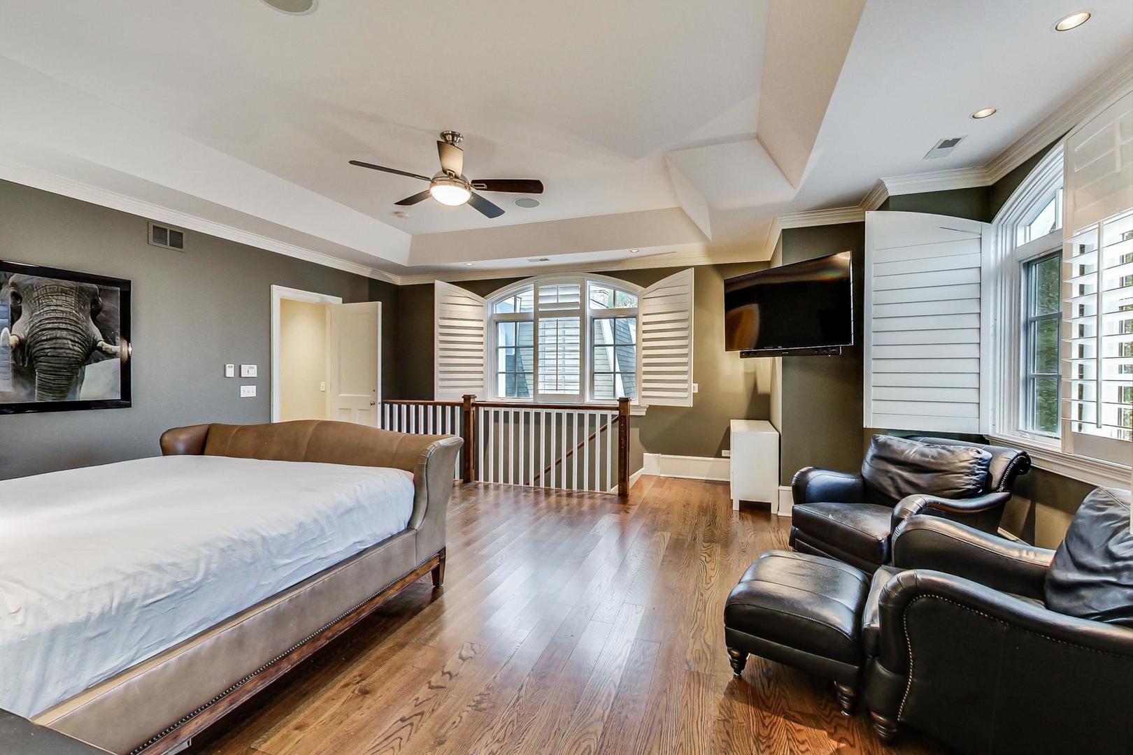 701 Plamondon Road Wheaton, IL 60189 - Photo 48 of 79 a bedroom with a bed a couch and a large window