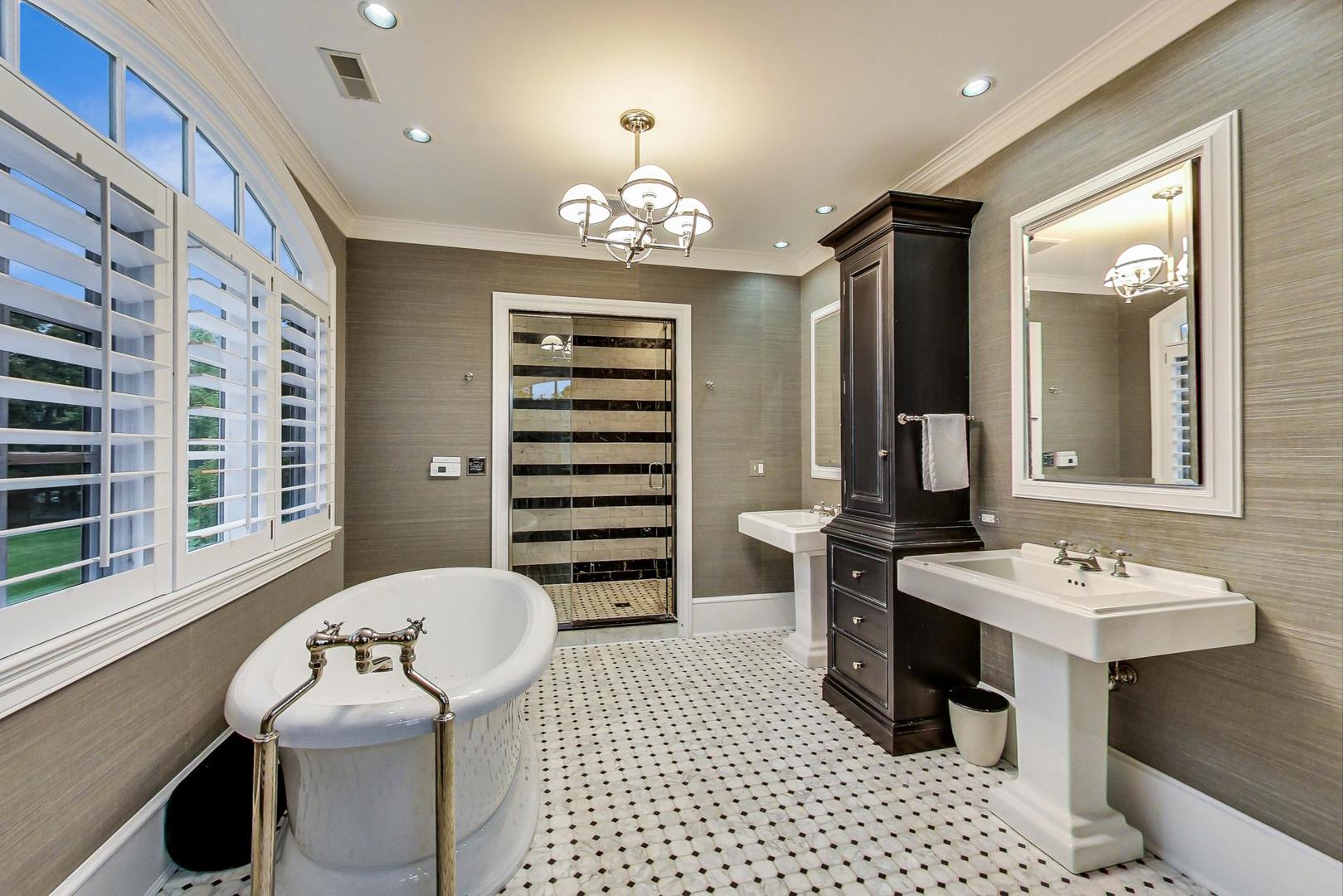 701 Plamondon Road Wheaton, IL 60189 - Photo 51 of 79 a bathroom with a sink a large mirror and a shower