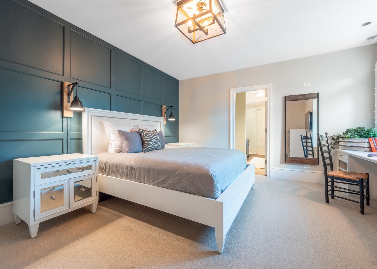 701 Plamondon Road Wheaton, IL 60189 - Photo 52 of 79 a bedroom with a bed and a chandelier