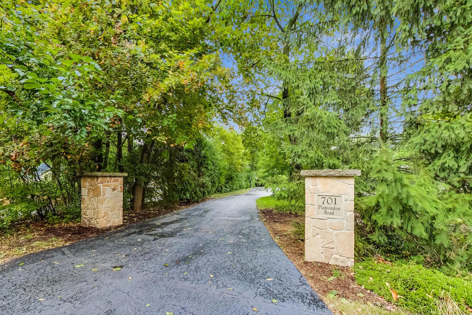 701 Plamondon Road Wheaton, IL 60189 - Photo 71 of 79 a sign board with a tree and fence
