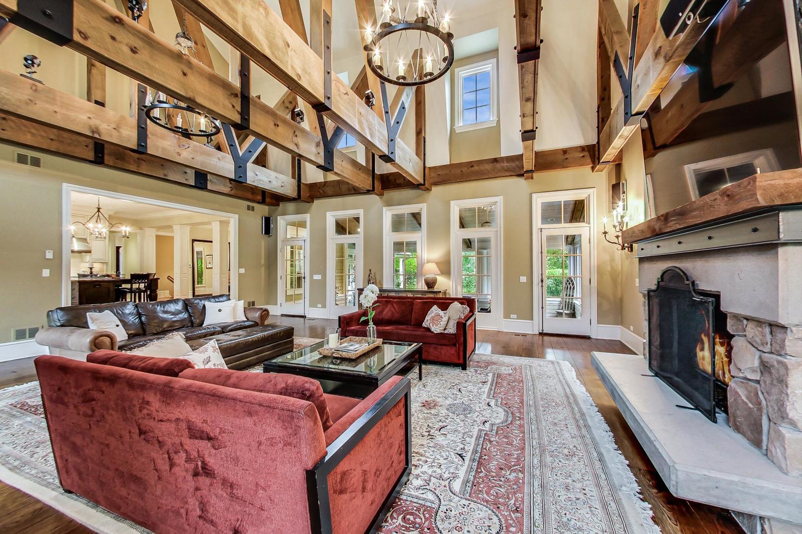 701 Plamondon Road Wheaton, IL 60189 - Photo 9 of 79 a living room with fireplace furniture and a floor to ceiling window