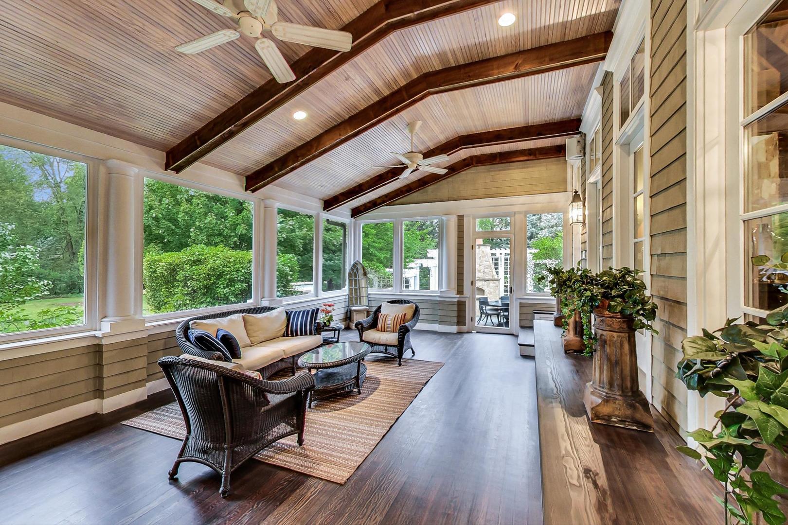 701 Plamondon Road Wheaton, IL 60189 - Photo 10 of 79 a living room with furniture and floor to ceiling windows