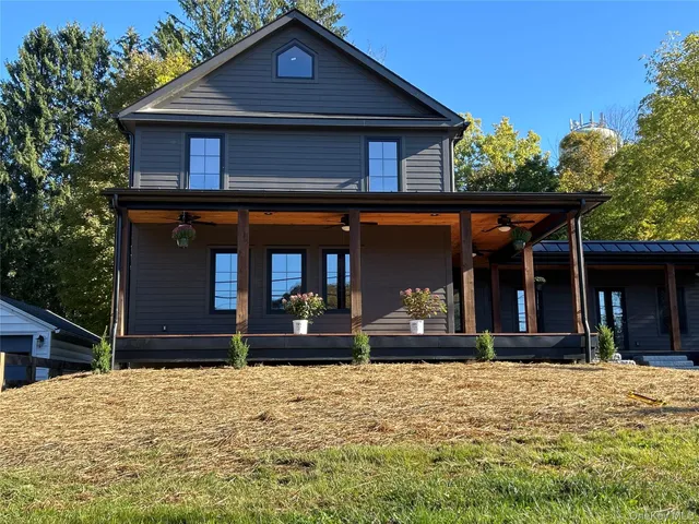 front view of a house with a yard