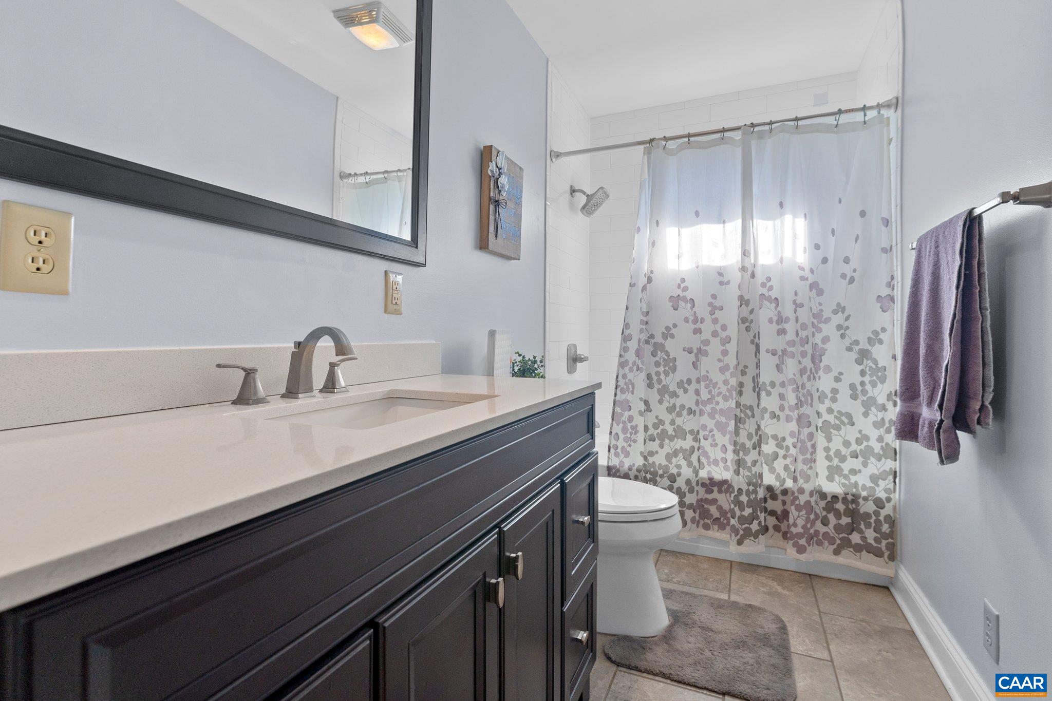 284 Jericho Road Fishersville, VA 22939 - Photo 11 of 30 a bathroom with a sink a toilet a shower and a mirror