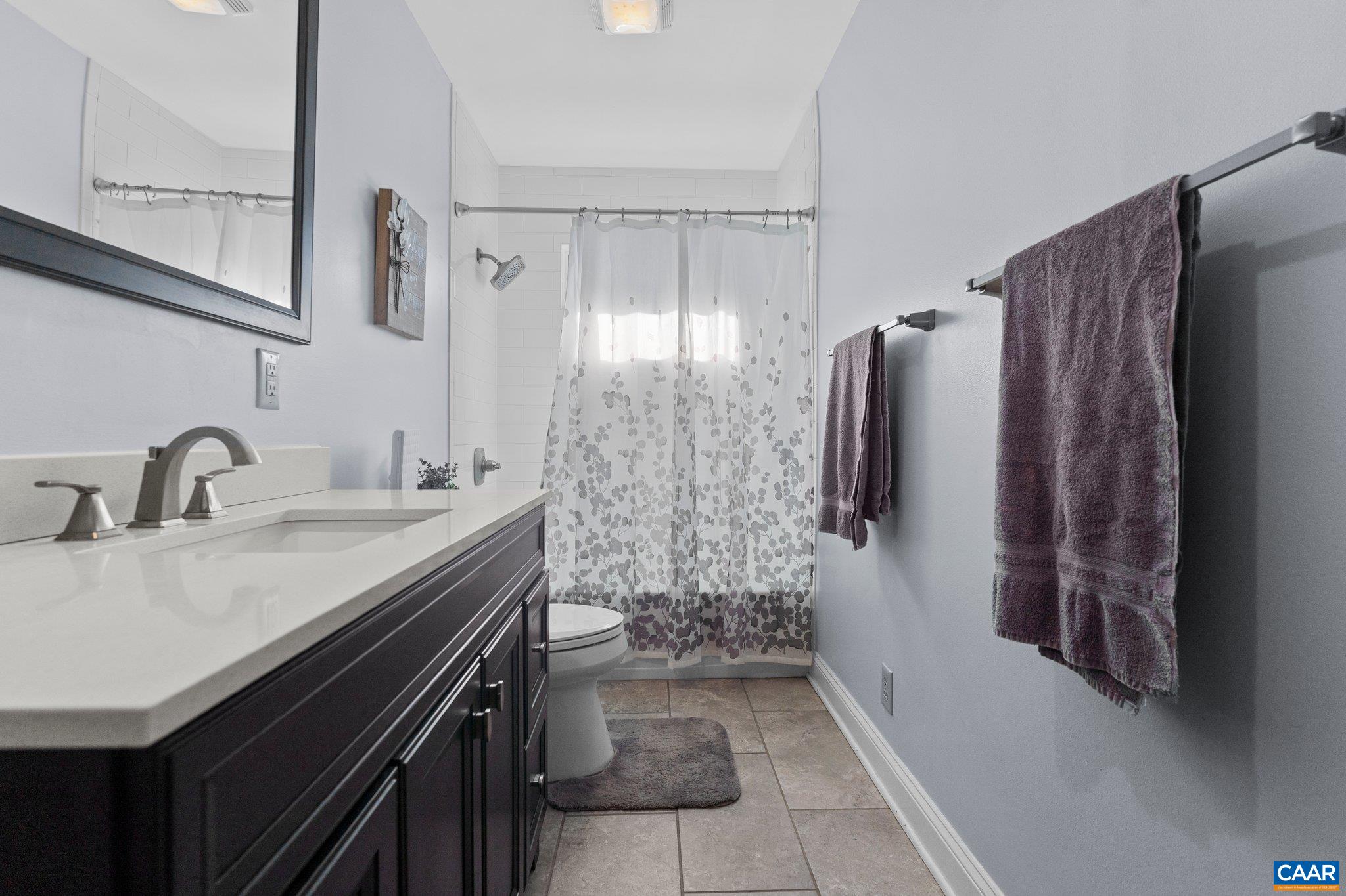 284 Jericho Road Fishersville, VA 22939 - Photo 12 of 30 a bathroom with a sink a toilet and shower