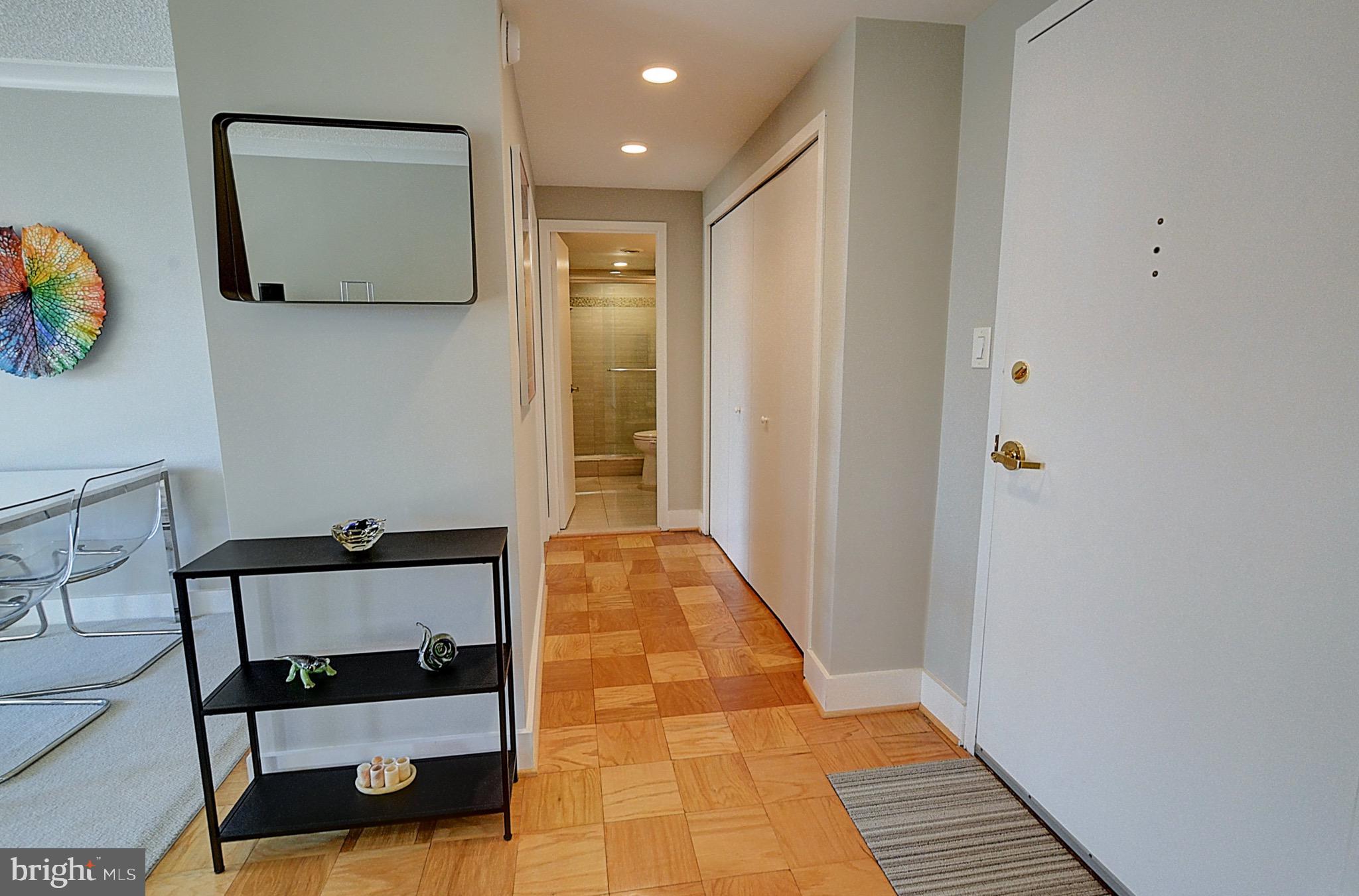 5225 Pooks Hill Road, Unit 121N Bethesda, MD 20814 - Photo 12 of 39 a hallway with dining area and entryway