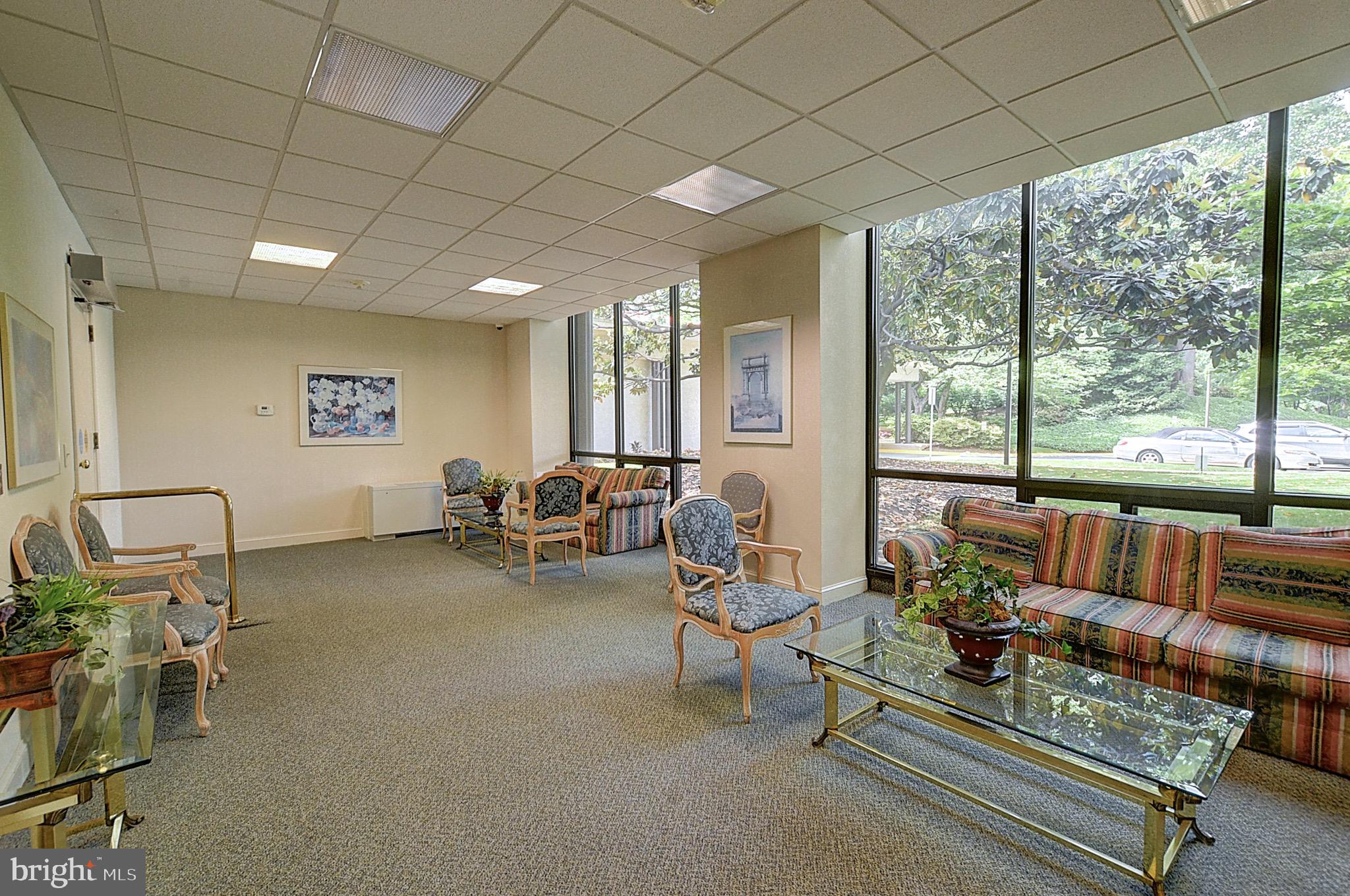 5225 Pooks Hill Road, Unit 121N Bethesda, MD 20814 - Photo 35 of 39 a living room with furniture and a large window
