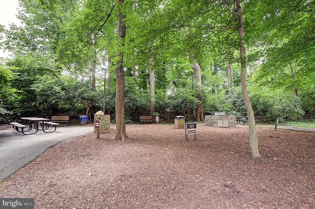 a view of a park with swings and slides