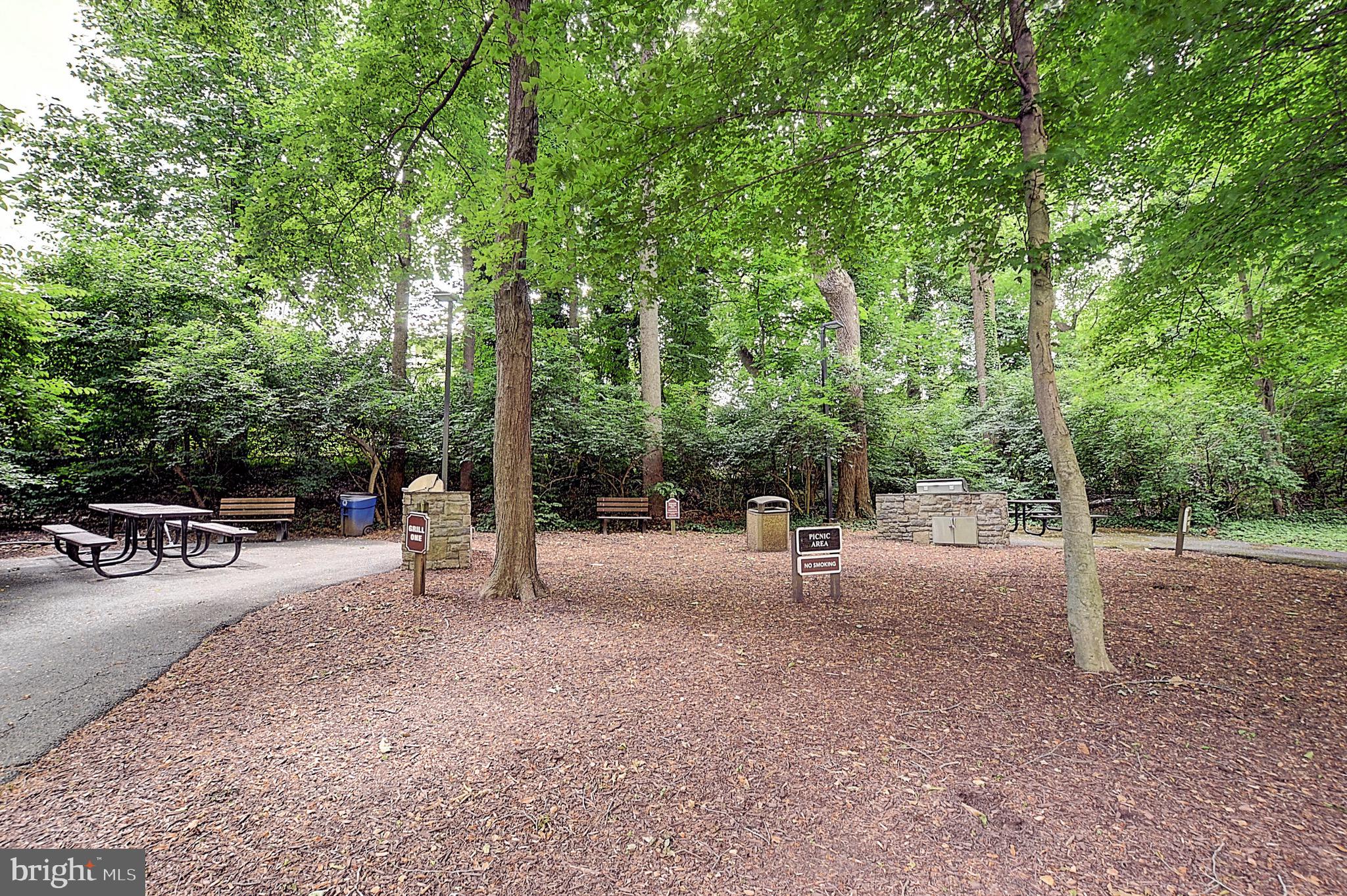 5225 Pooks Hill Road, Unit 121N Bethesda, MD 20814 - Photo 38 of 39 a view of a park with swings and slides