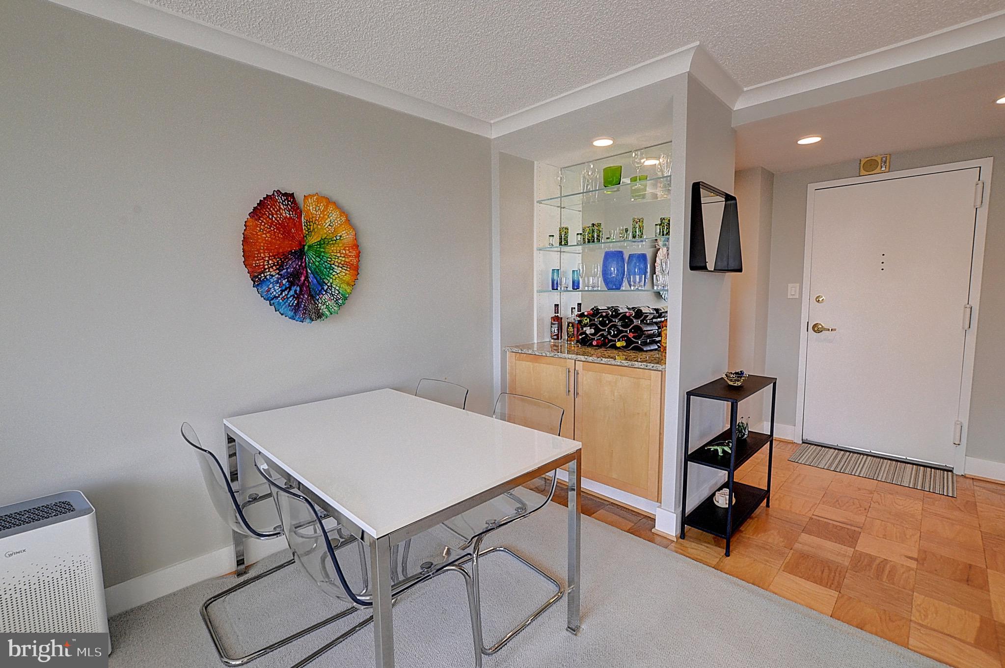 5225 Pooks Hill Road, Unit 121N Bethesda, MD 20814 - Photo 4 of 39 a view of a dining room with furniture and a rug
