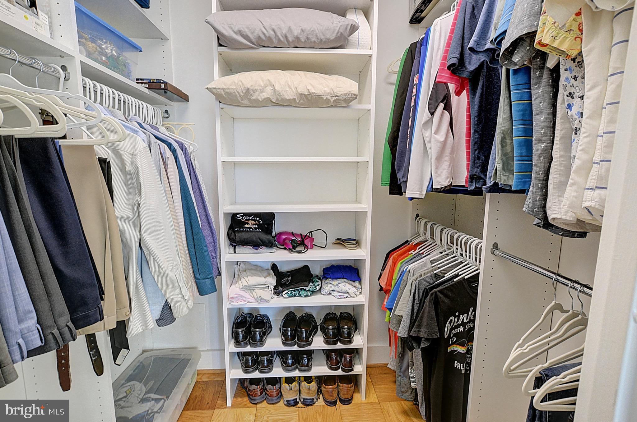 5225 Pooks Hill Road, Unit 121N Bethesda, MD 20814 - Photo 7 of 39 a view of walk in closet with clothes and shoes