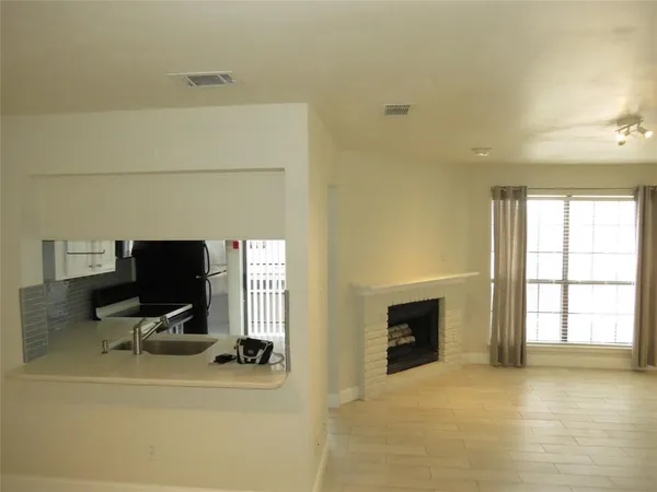 a black and white building with black door
