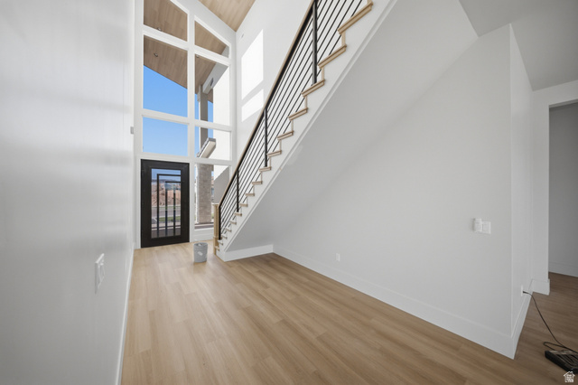 3011 East Rimrunner Drive, Unit 302 St. George, UT 84790 - Photo 18 of 45 Foyer featuring light wood-style floors and a vaulted wooden ceiling