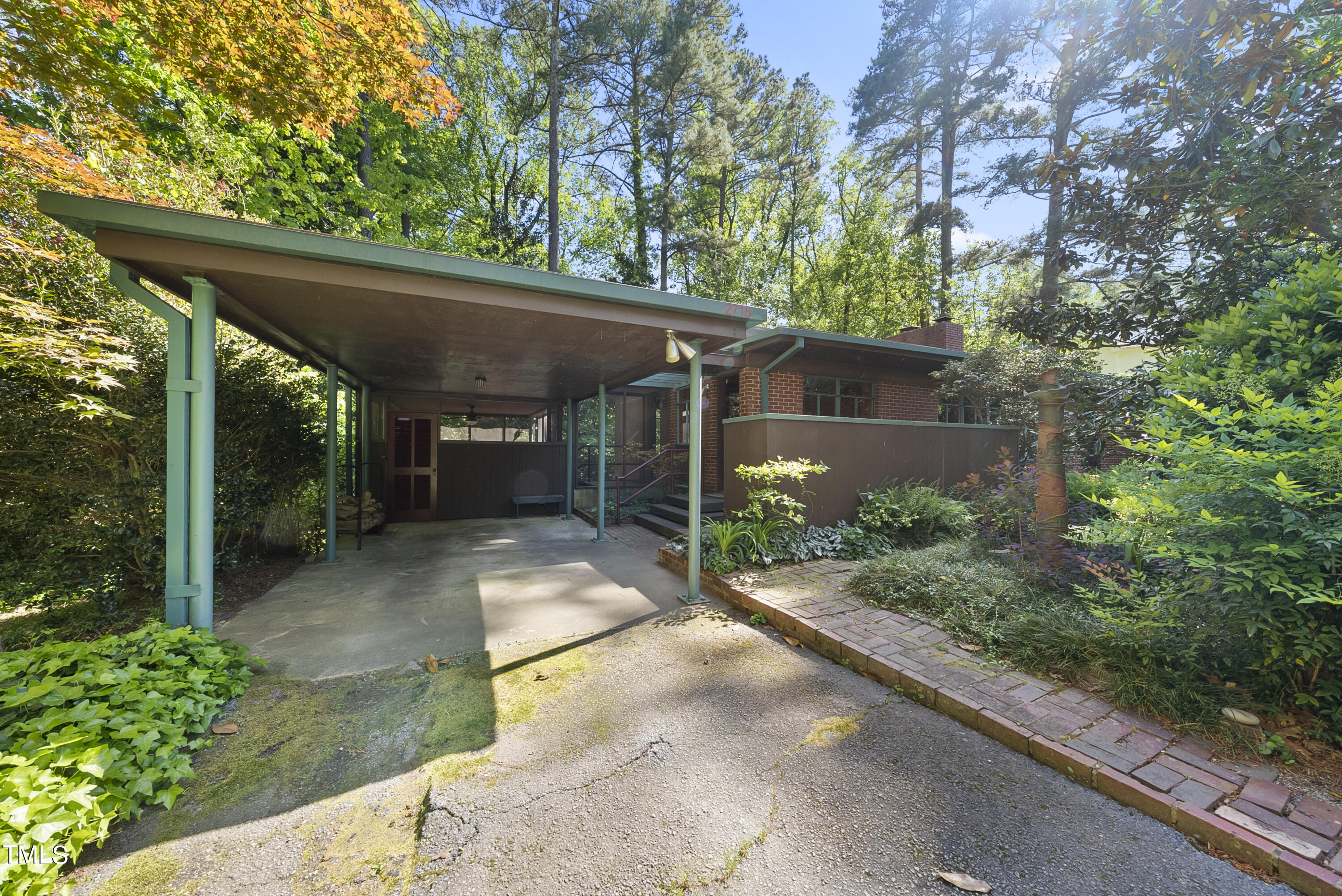 2715 Rosedale Avenue Raleigh, NC 27607 - Photo 23 of 46 One car Carport wil steel post, and entry to the screened porch