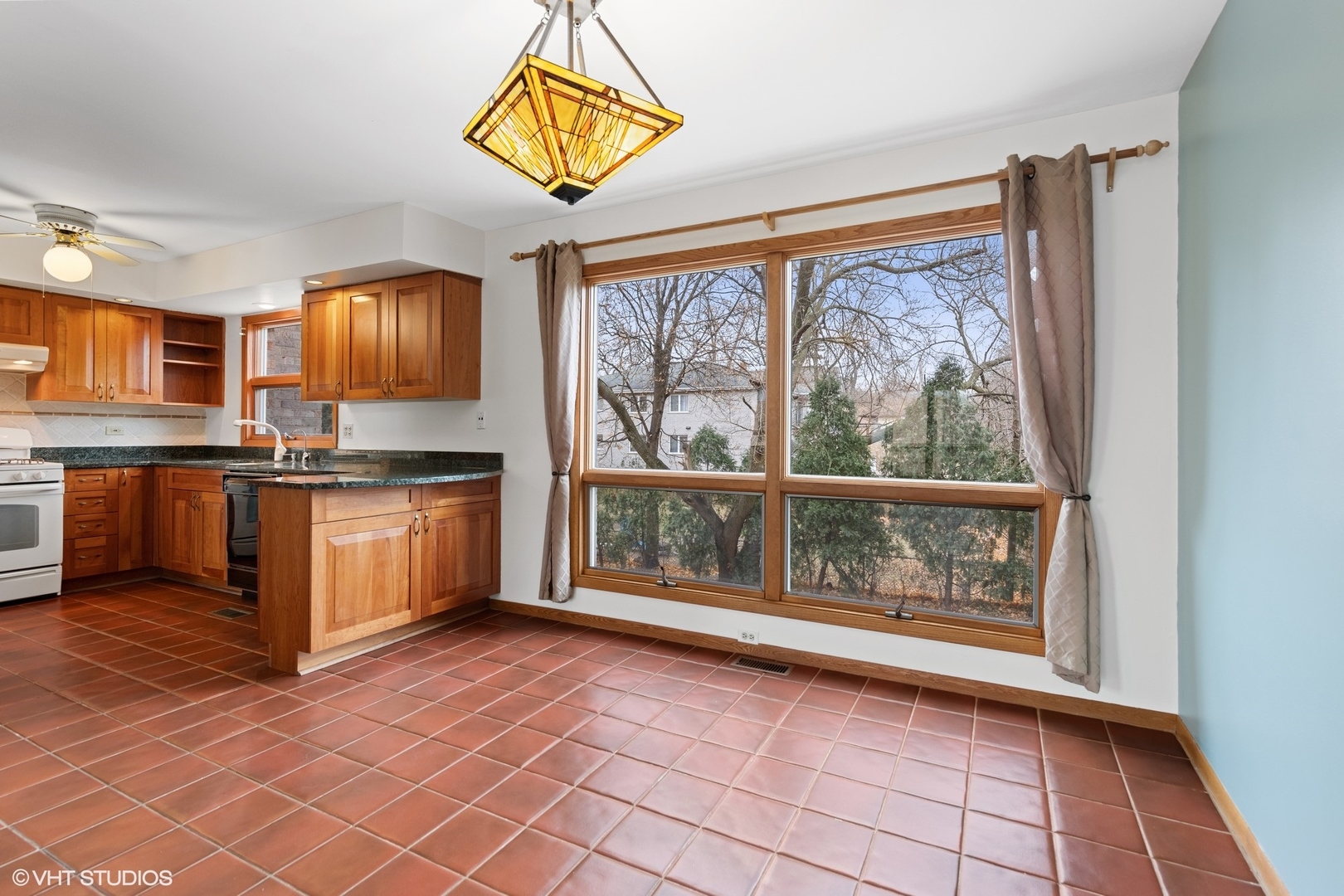 3700 Haas Avenue Riverside, IL 60546 - Photo 8 of 20 a kitchen with stainless steel appliances granite countertop a stove a sink and a microwave