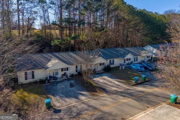 a aerial view of a house with a yard