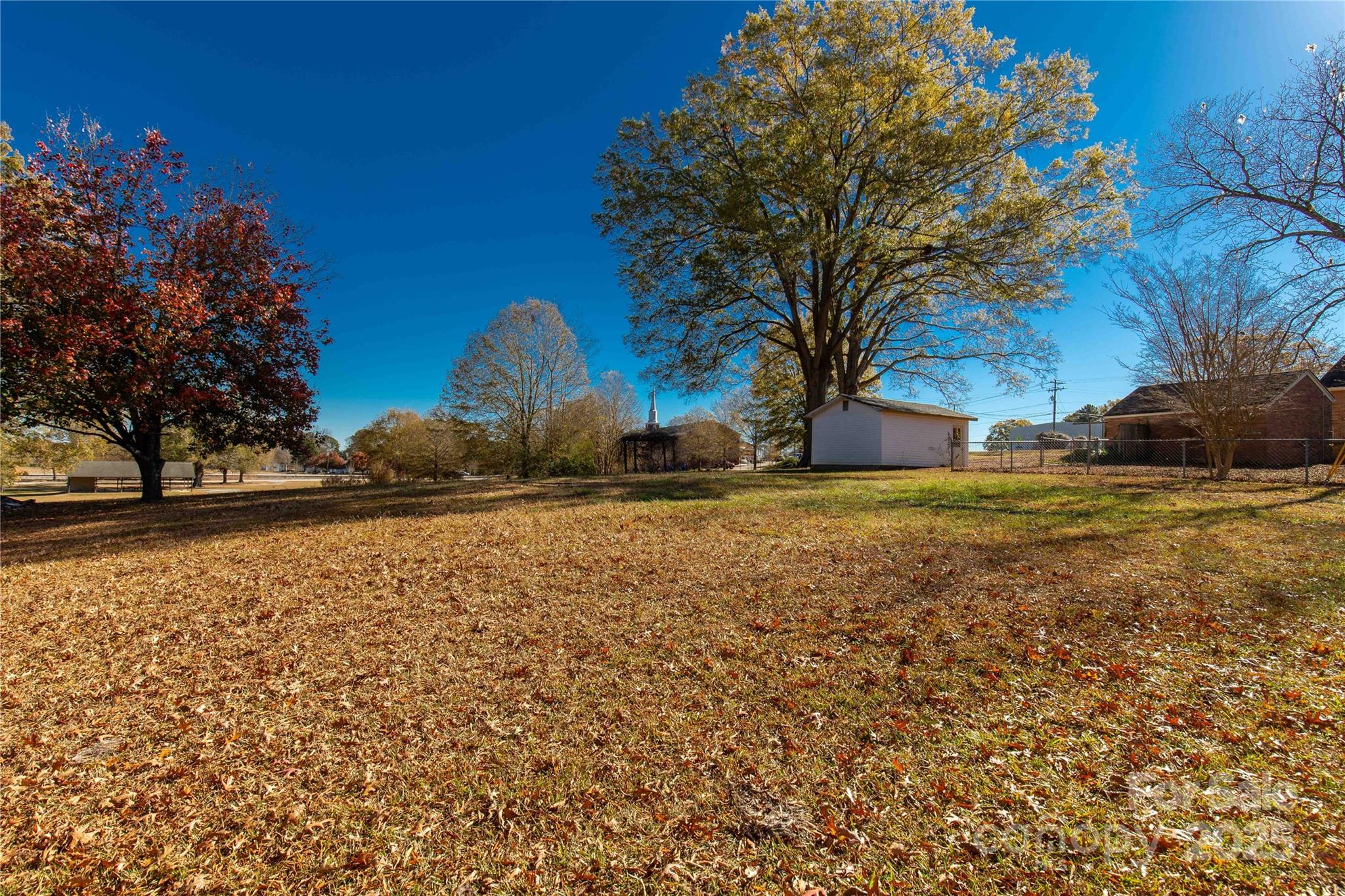 2429 State Rd S-29-746 Lancaster, SC 29720 - Photo 14 of 31 a view of a yard with large trees