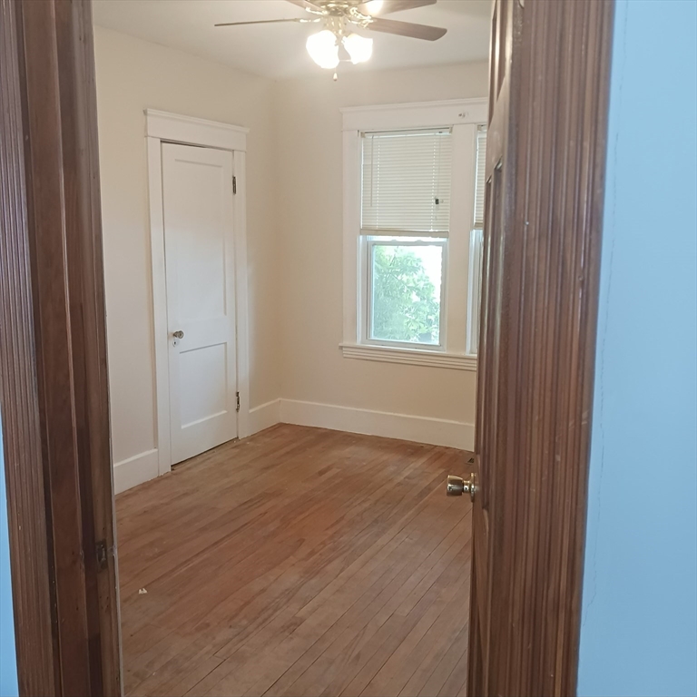 14 Douglas Court Worcester, MA 01603 - Photo 6 of 20 a view of an empty room with closet and a window
