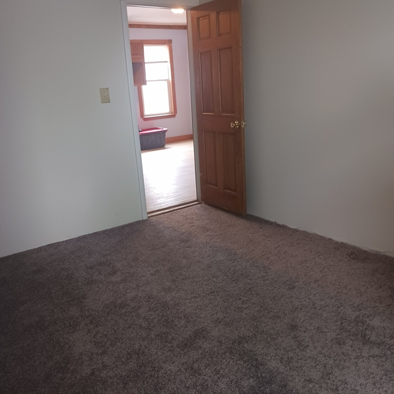 14 Douglas Court Worcester, MA 01603 - Photo 7 of 20 an empty room with windows