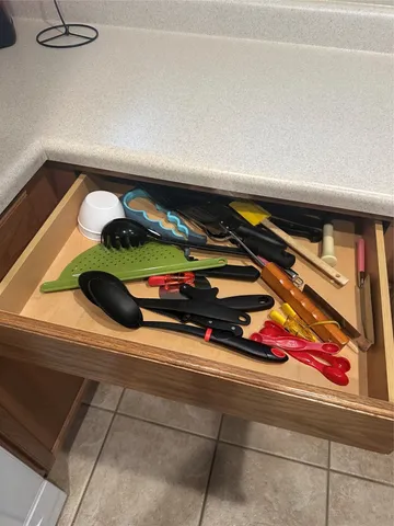 a room with a wooden floor and shelf