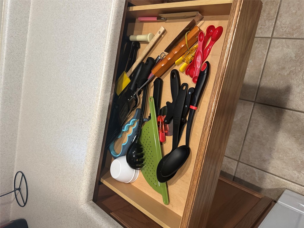 340 Portsmouth Drive Georgetown, TX 78633 - Photo 16 of 17 a utility room with lots of trees