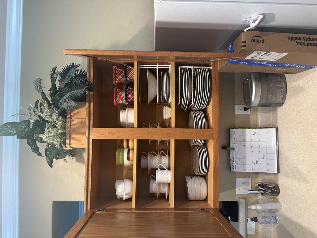 340 Portsmouth Drive Georgetown, TX 78633 - Photo 17 of 17 a room with a wooden floor and shelf