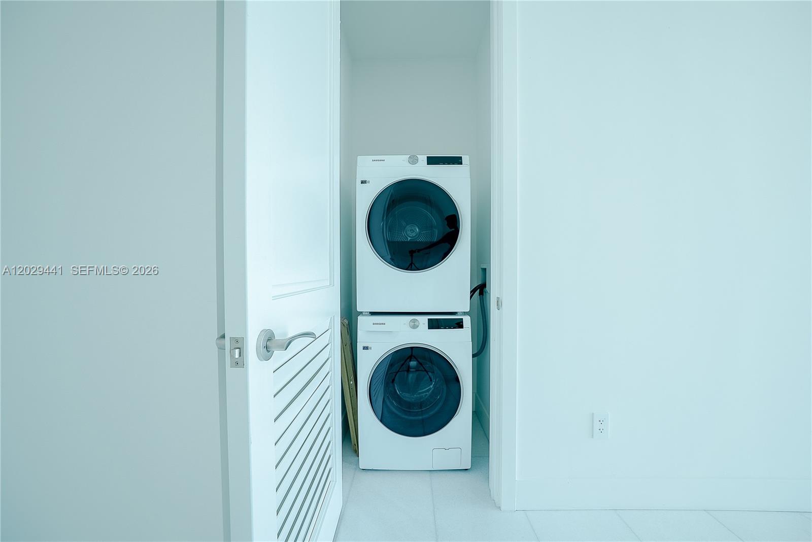175 Southeast 25th Road, Unit 2103 Miami, FL 33129 - Photo 27 of 27 a utility room with dryer and washer