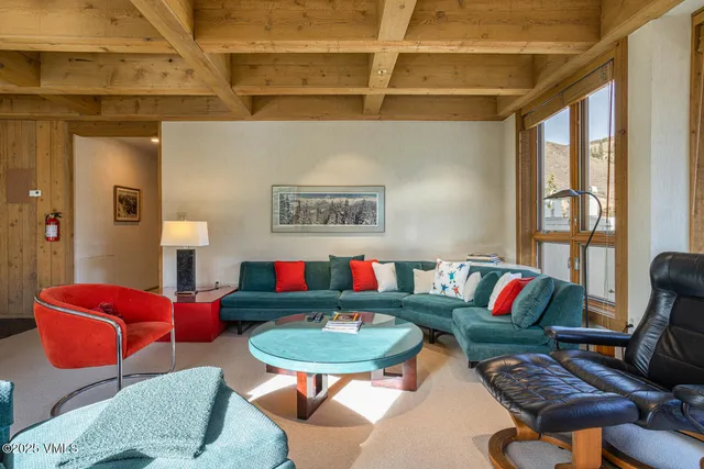 a living room with furniture and a rug