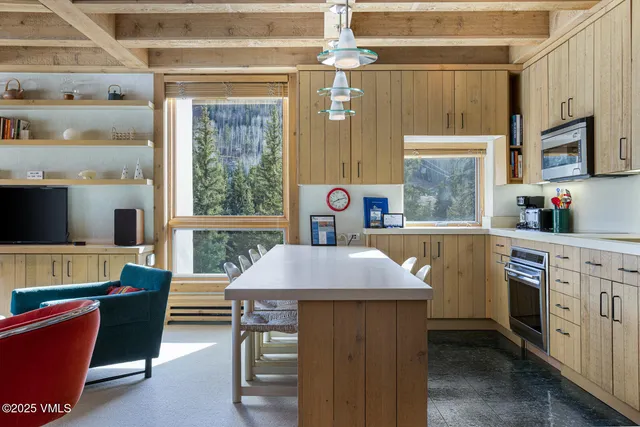 a kitchen with a stove a sink and a refrigerator
