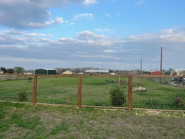 a view of a field with grass