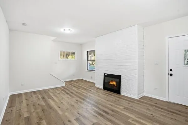 a view of entryway with wooden floor