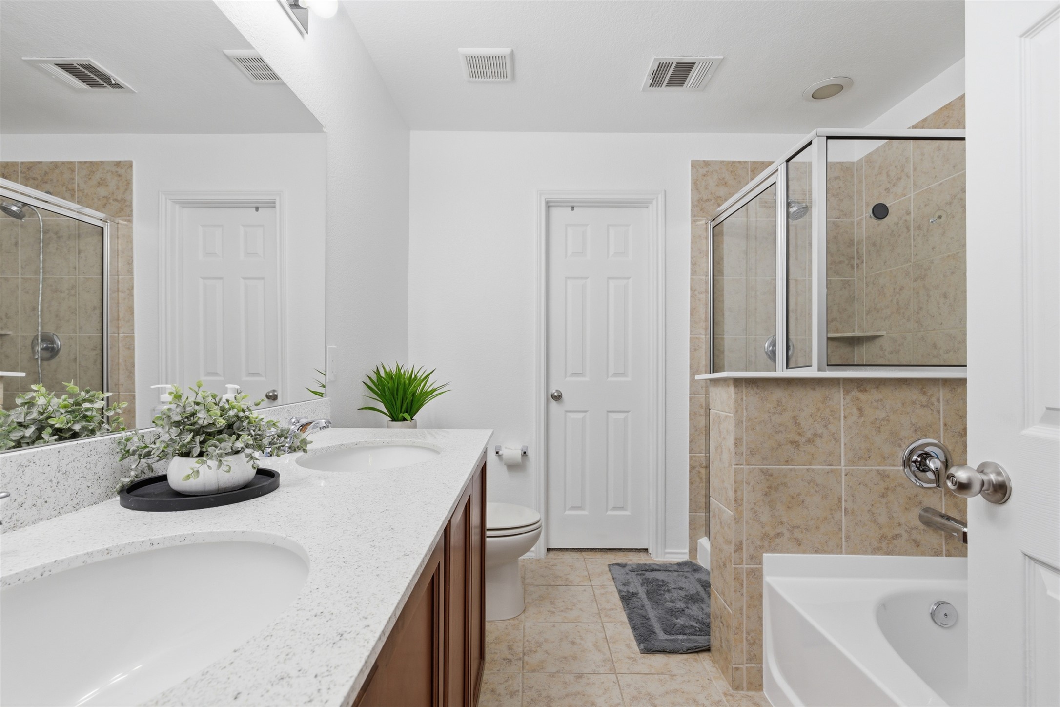 101 Magpie Goose Lane Leander, TX 78641 - Photo 15 of 29 a bath room with a bathtub and a shower
