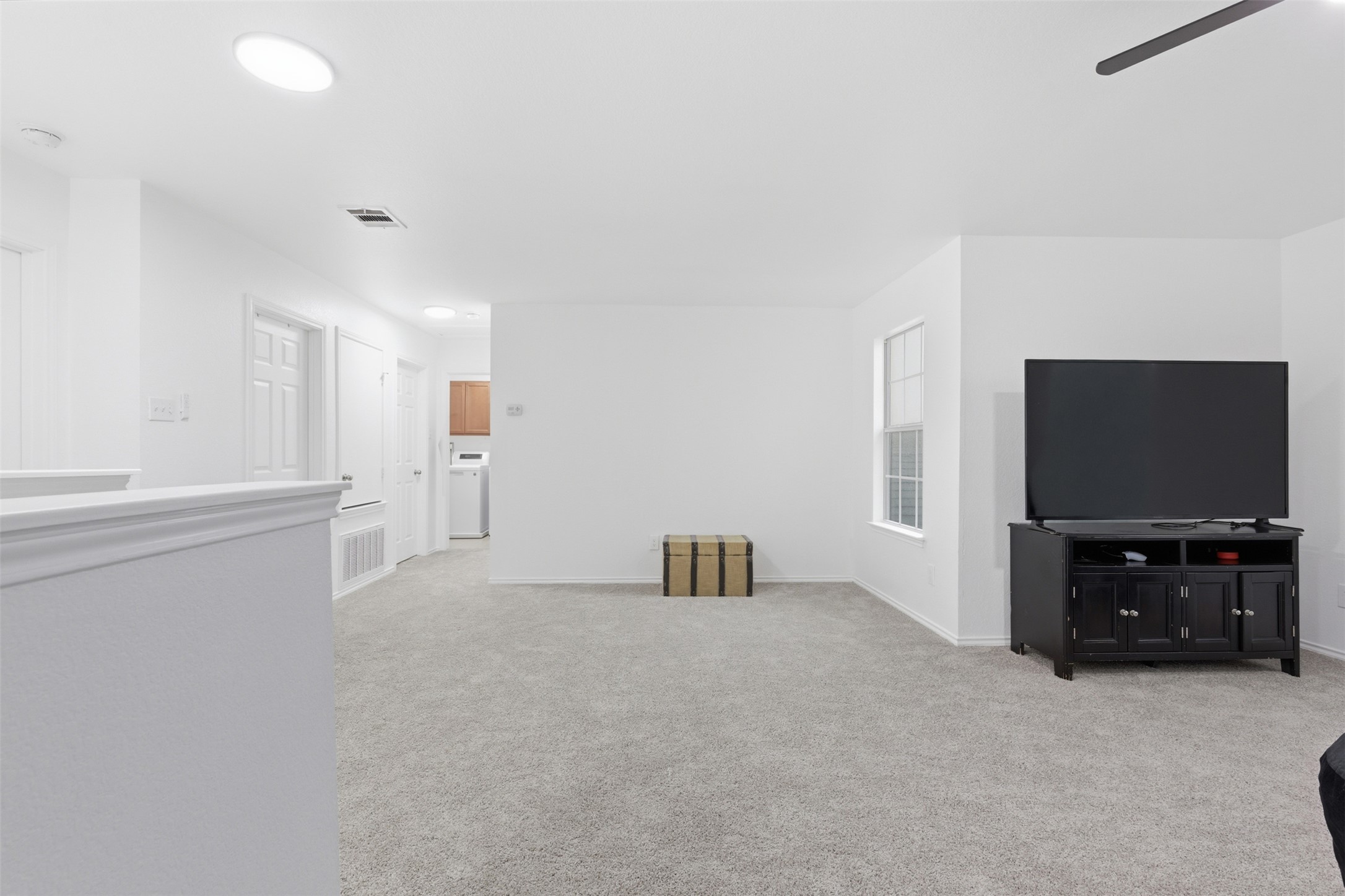 101 Magpie Goose Lane Leander, TX 78641 - Photo 17 of 29 a living room with furniture and a flat screen tv