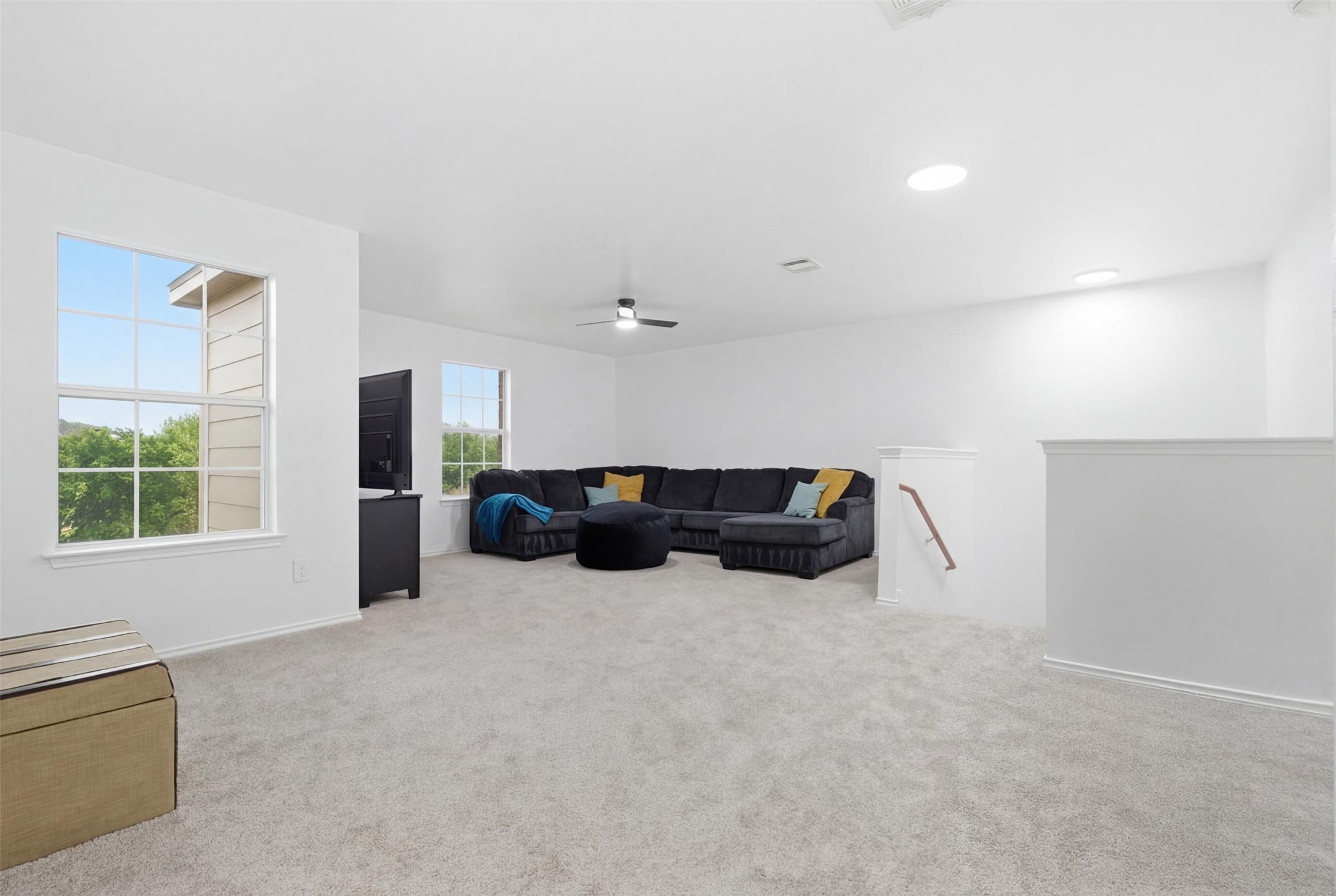 101 Magpie Goose Lane Leander, TX 78641 - Photo 20 of 29 a large room with furniture and a large window