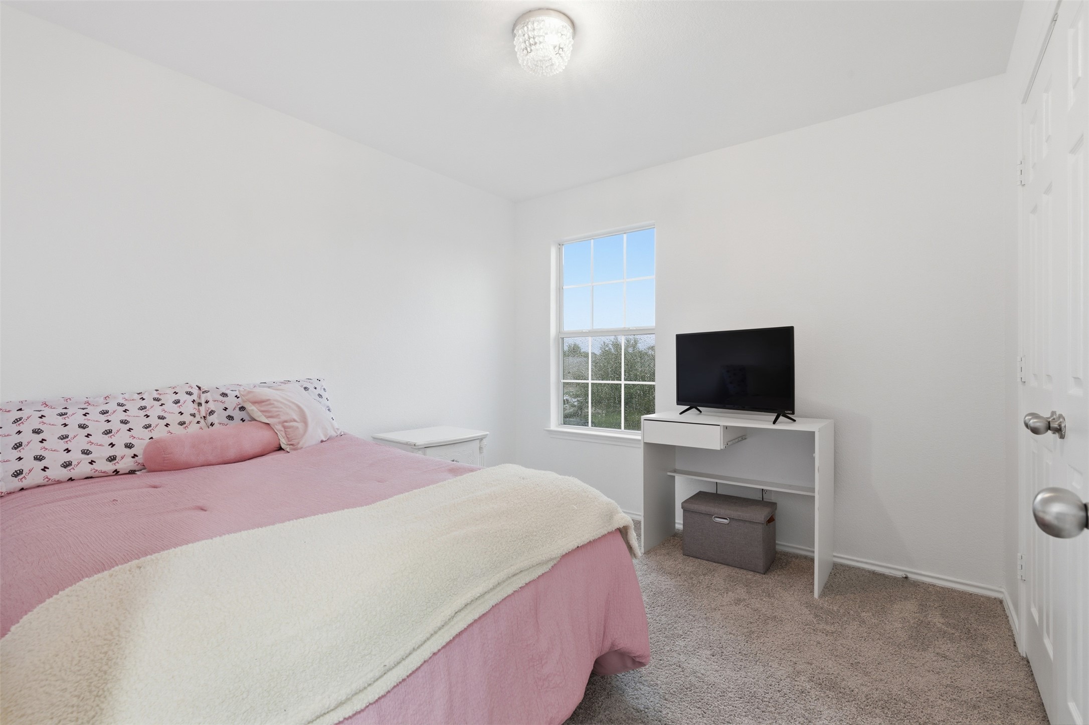 101 Magpie Goose Lane Leander, TX 78641 - Photo 21 of 29 a bedroom with a bed and a flat screen tv
