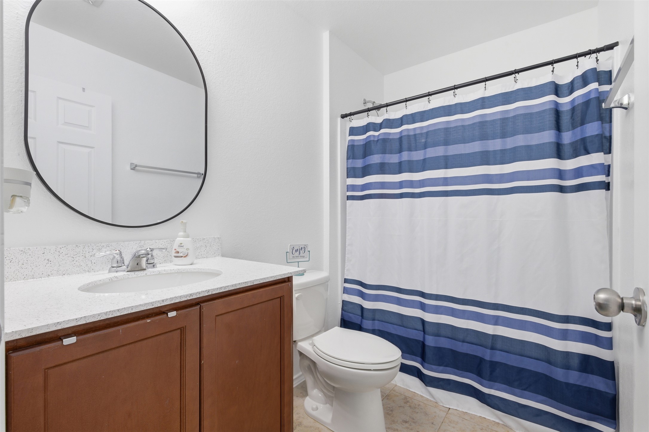 101 Magpie Goose Lane Leander, TX 78641 - Photo 23 of 29 a bathroom with a sink a toilet and a mirror