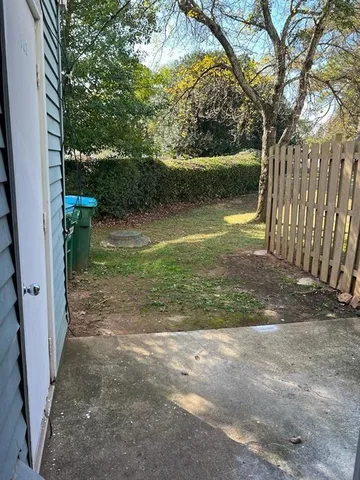 a backyard of a house with lots of green space