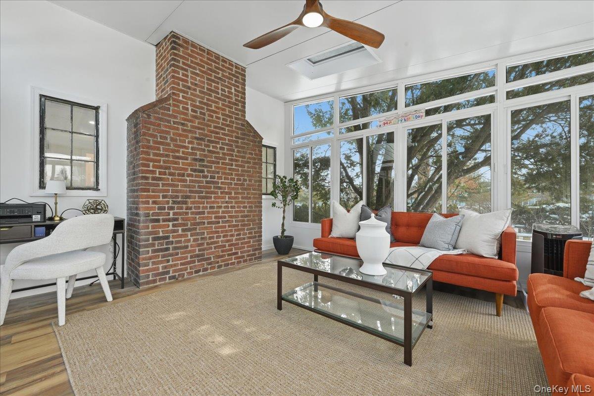 210 Clinton Road Garden City, NY 11530 - Photo 26 of 31 a living room with furniture and a window