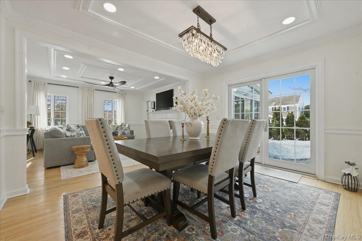 210 Clinton Road Garden City, NY 11530 - Photo 7 of 31 a view of a dining room with furniture window and wooden floor