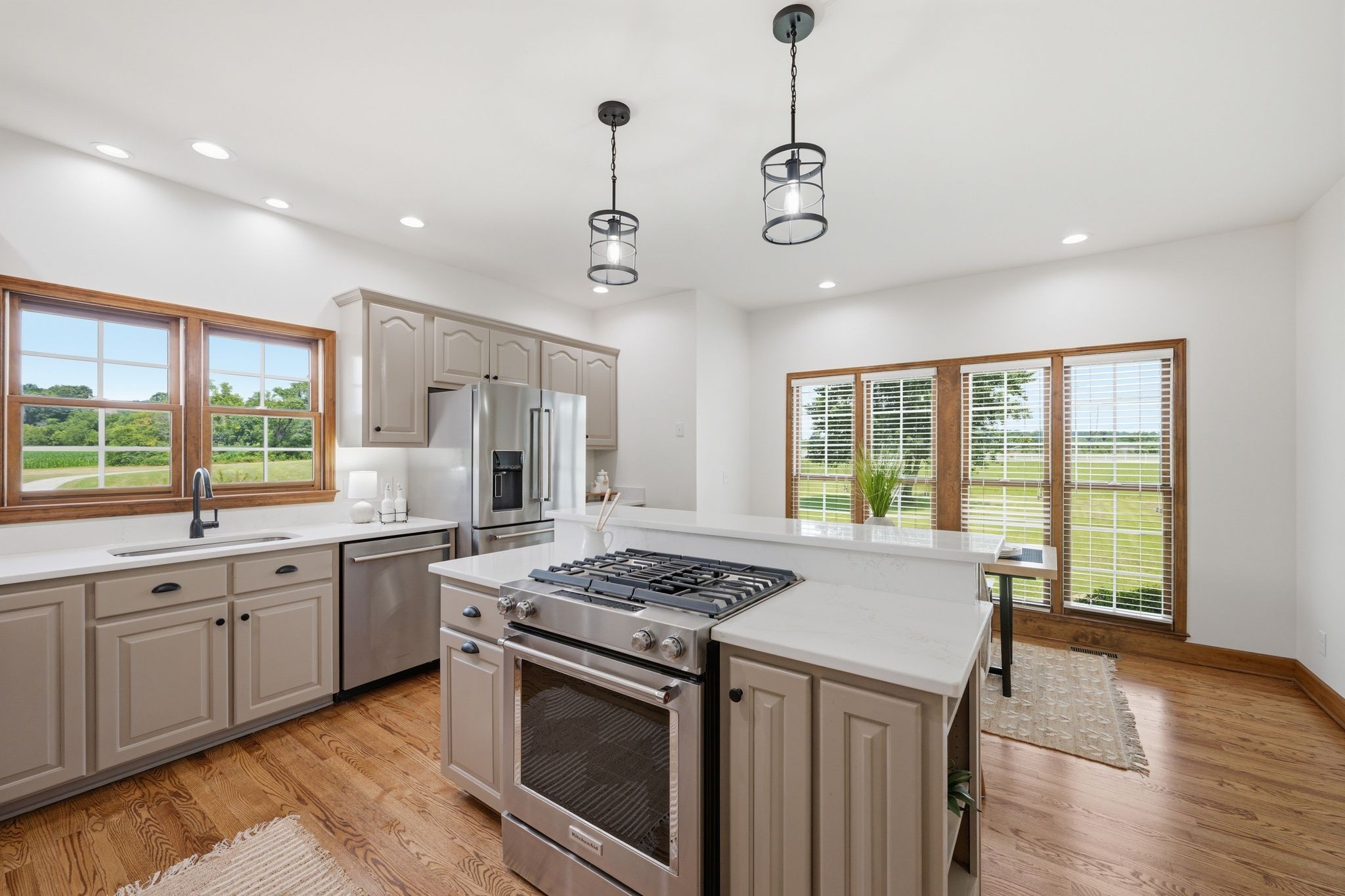 8167 Primm Springs Road Primm Springs, TN 38476 - Photo 20 of 65 a open kitchen with stainless steel appliances granite countertop a stove and a sink
