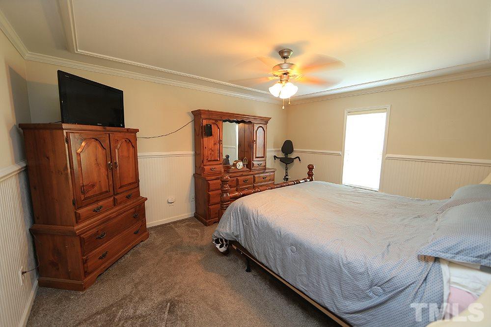 1440 Wendell Road Wendell, NC 27591 - Photo 11 of 19 Master Bedroom has 1 side of the home all to itself. King bed and furniture here available for sale.