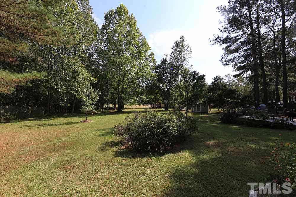 1440 Wendell Road Wendell, NC 27591 - Photo 17 of 19 1.3 acres of lovely landscaped yard with variety of trees such as dogwoods, crepe myrtles and a lemon tree.