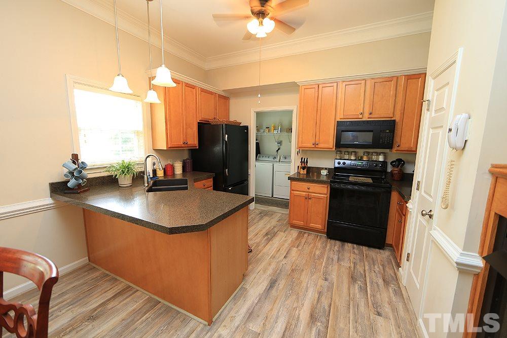 Many updates in this kitchen such as granite counters, lighting and new floors.