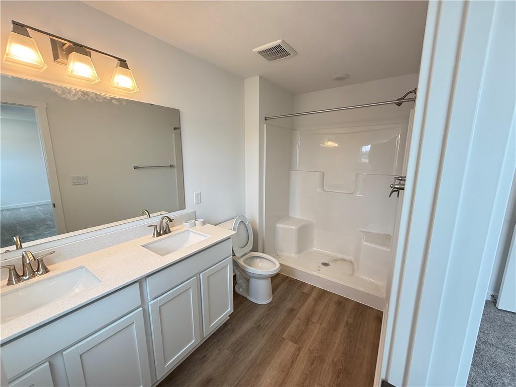 175 Lockheed Drive Coraopolis, PA 15108 - Photo 14 of 17 a spacious bathroom with a double vanity sink toilet and shower