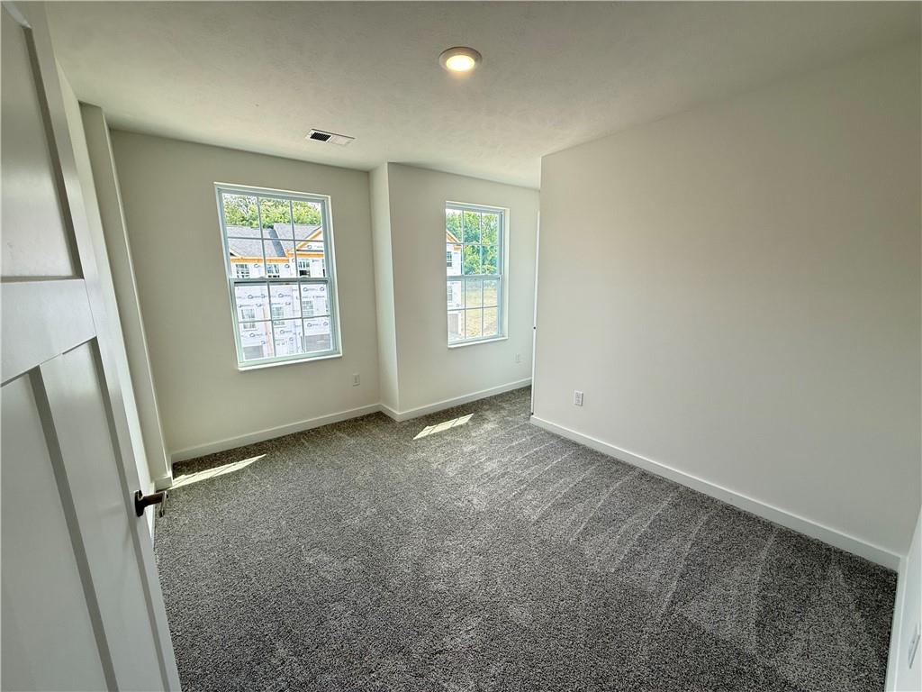 175 Lockheed Drive Coraopolis, PA 15108 - Photo 15 of 17 an empty room with windows