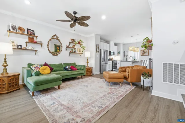 a bedroom with furniture and a large window