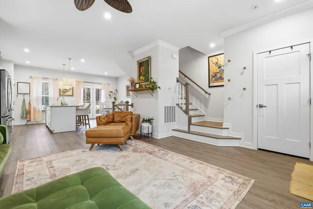 a living room with furniture and a rug