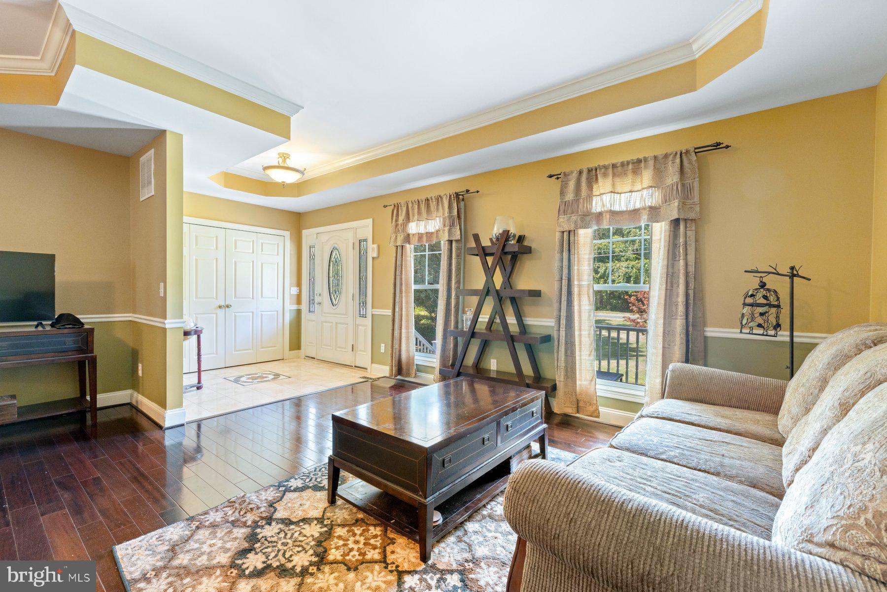 61 Magothy Beach Road Pasadena, MD 21122 - Photo 11 of 63 a living room with furniture and a large window