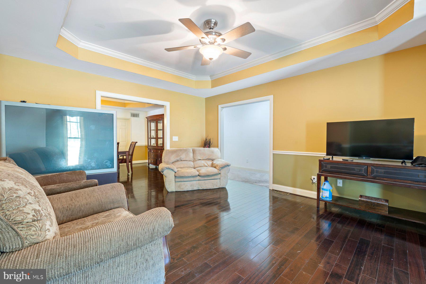 61 Magothy Beach Road Pasadena, MD 21122 - Photo 12 of 63 a living room with furniture and a flat screen tv